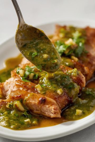 Mojo Cubano spooned over sliced roasted pork
