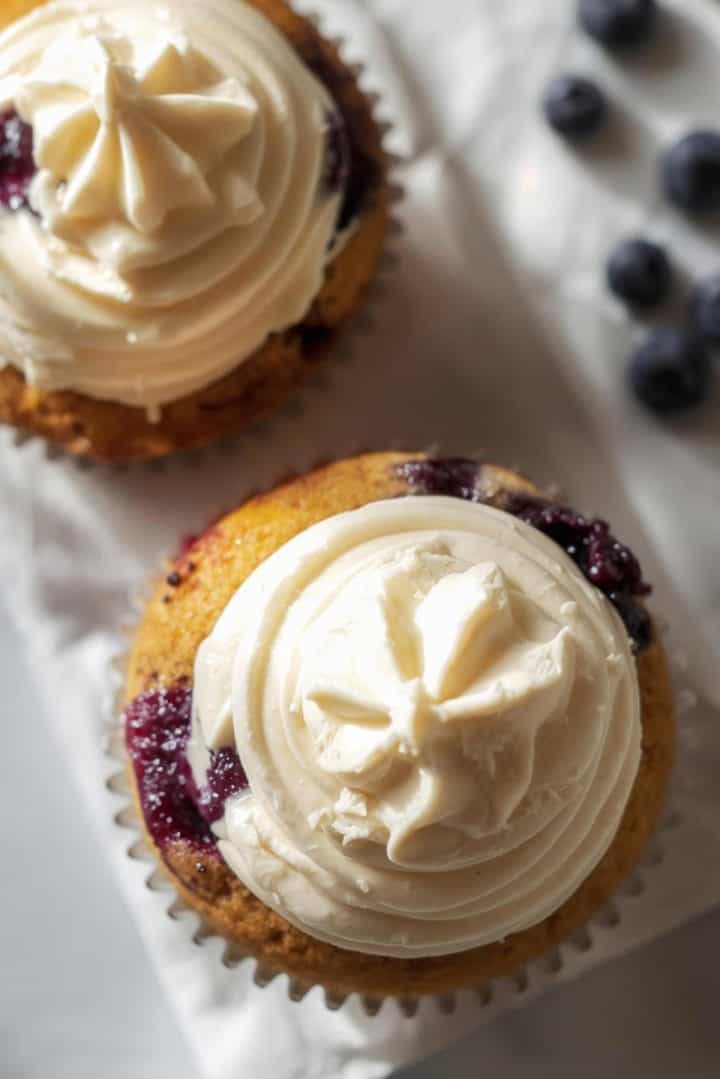 Blueberry lemon cupcakes with cream cheese frosting, window light