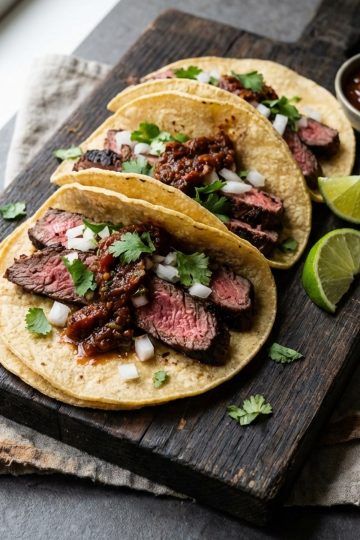 Carne Asada in the oven tacos in awooden board
