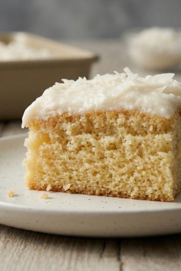 Coconut Sheet Cake with Cream Cheese Frosting 1 Coconut sheet cake with cream cheese frosting in a 9×13 pan profile shot