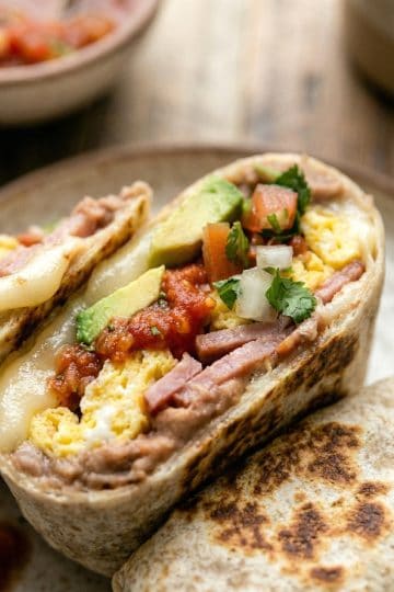 Mexican Breakfast Burrito Close-up texture shot in a plate