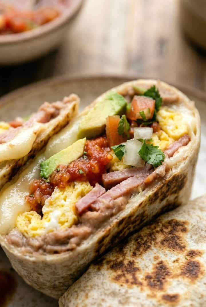 Mexican Breakfast Burrito Close-up texture shot in a plate