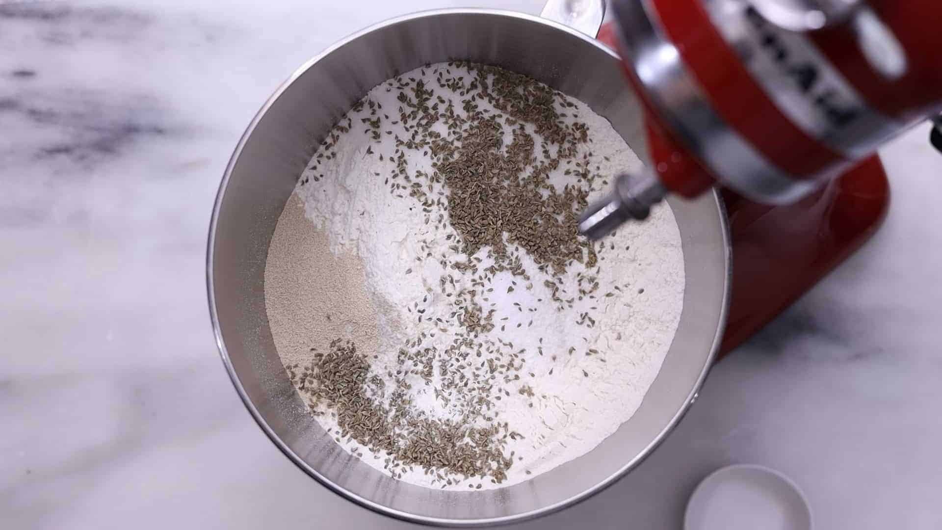 combine flour, salt, sugar, anise seeds, and instant dry yeast. ¾