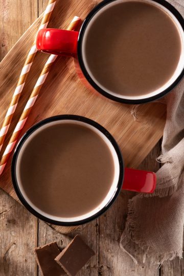 Champurrado in a red cup