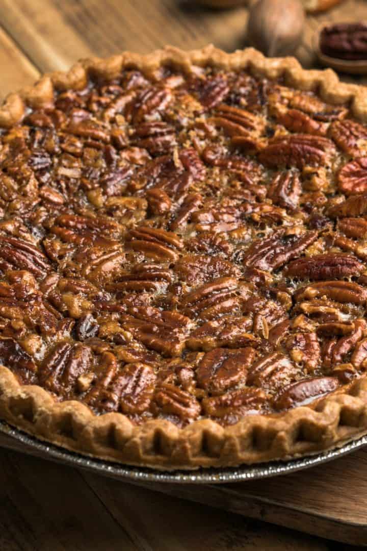 Pecan pie without corn syrup in a wooded cutting board