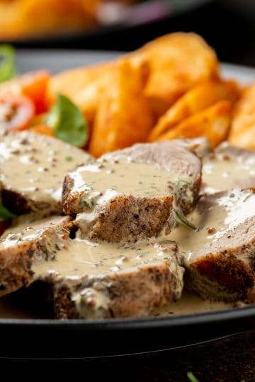Sliced pork tenderloin with mustard sauce